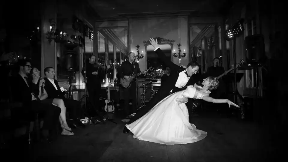 Lucy & Michael 2 Bride and groom performing their first dance with band playing in the background - Scott Gilbert Wedding Photography