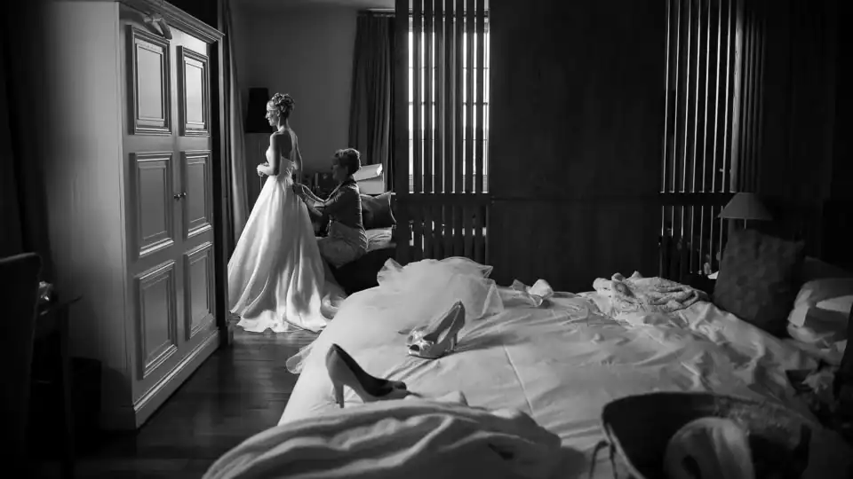 Lucy & Michael 12 Bride gets her dress fitted in the bedroom - Scott Gilbert Wedding Photography