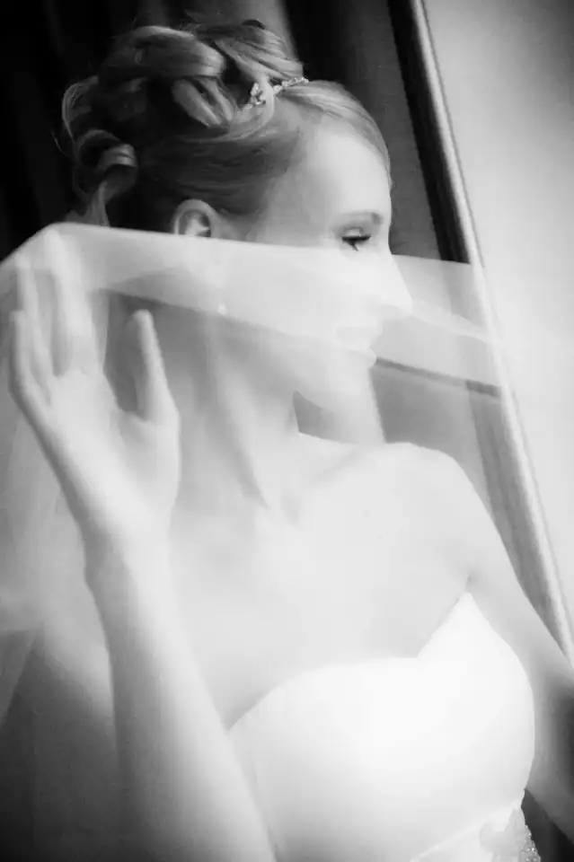 Lucy & Michael 17 Bride hides behind her veil so no one sees her through the window - Scott Gilbert Wedding Photography