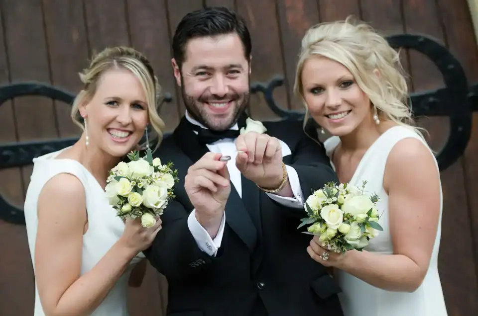 Lucy & Michael 16 Best man shows the wedding rings with two bridesmaids checking on him - Scott Gilbert Wedding Photography