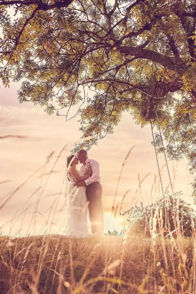 Couple share happy moments in field - Scott Gilbert Wedding Photography