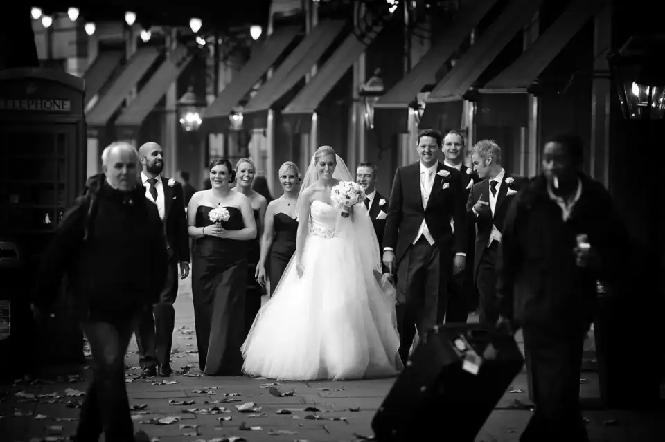 Bridal party make their way through Cambridge streets - Scott Gilbert Wedding Photography