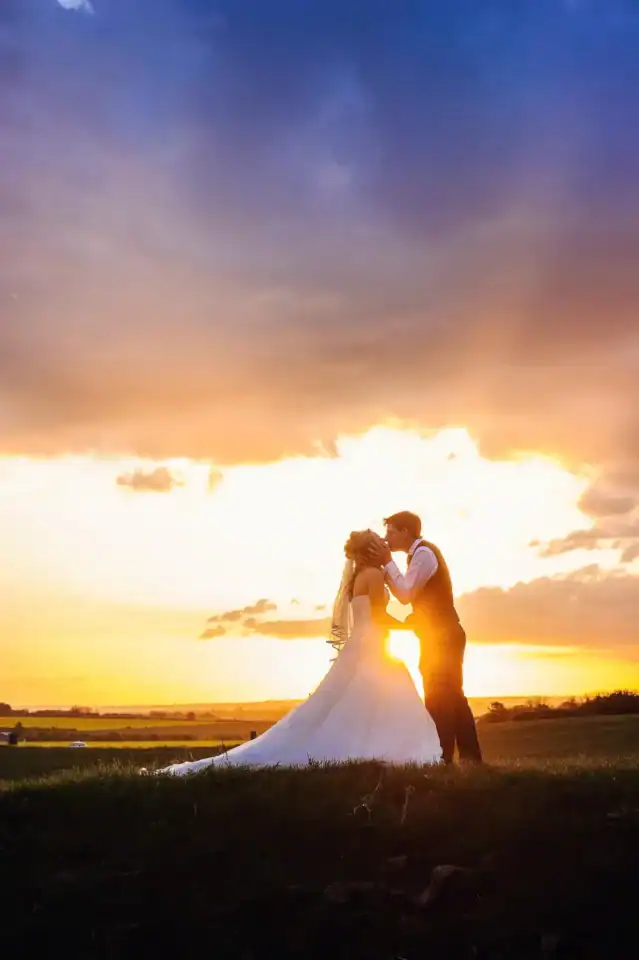 Couple kiss whilst the sun sets - Scott Gilbert Wedding Photography