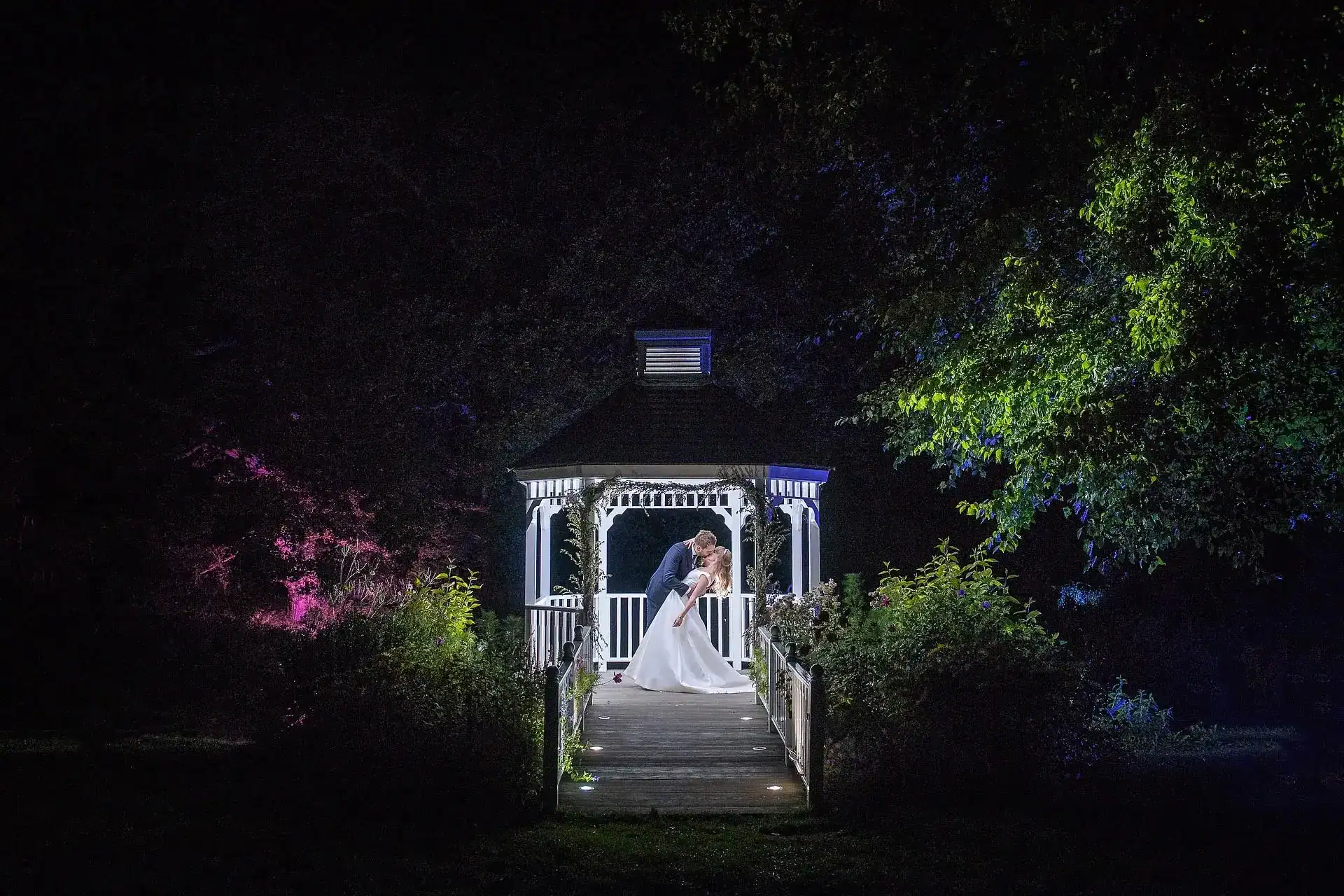 Bridal couple share first kiss at Sheene Mill Cambridgeshire - Scott Gilbert Wedding Photography