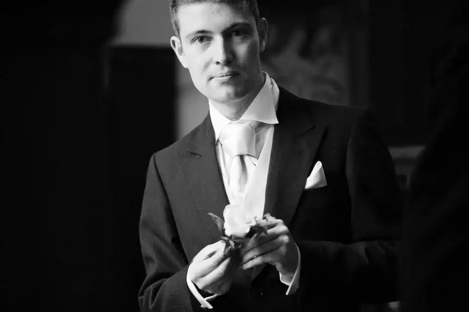 Groom fixes her pocket flower before ceremony - Scott Gilbert Wedding Photography