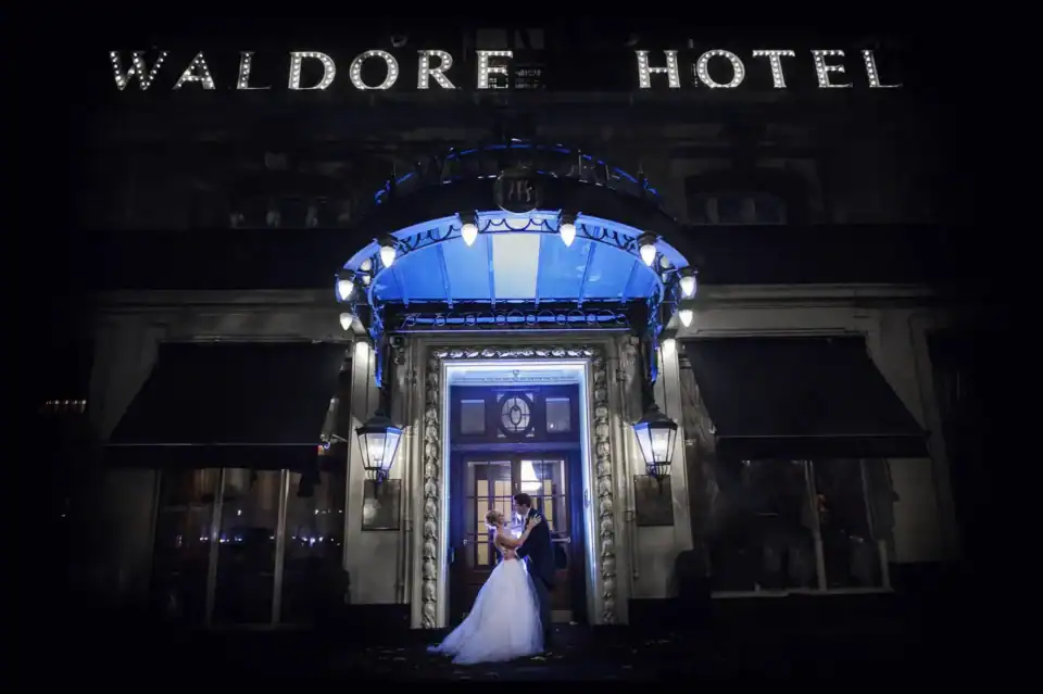Happy couple gaze into each others eyes outside Waldorf Hotel London - Scott Gilbert Wedding Photography