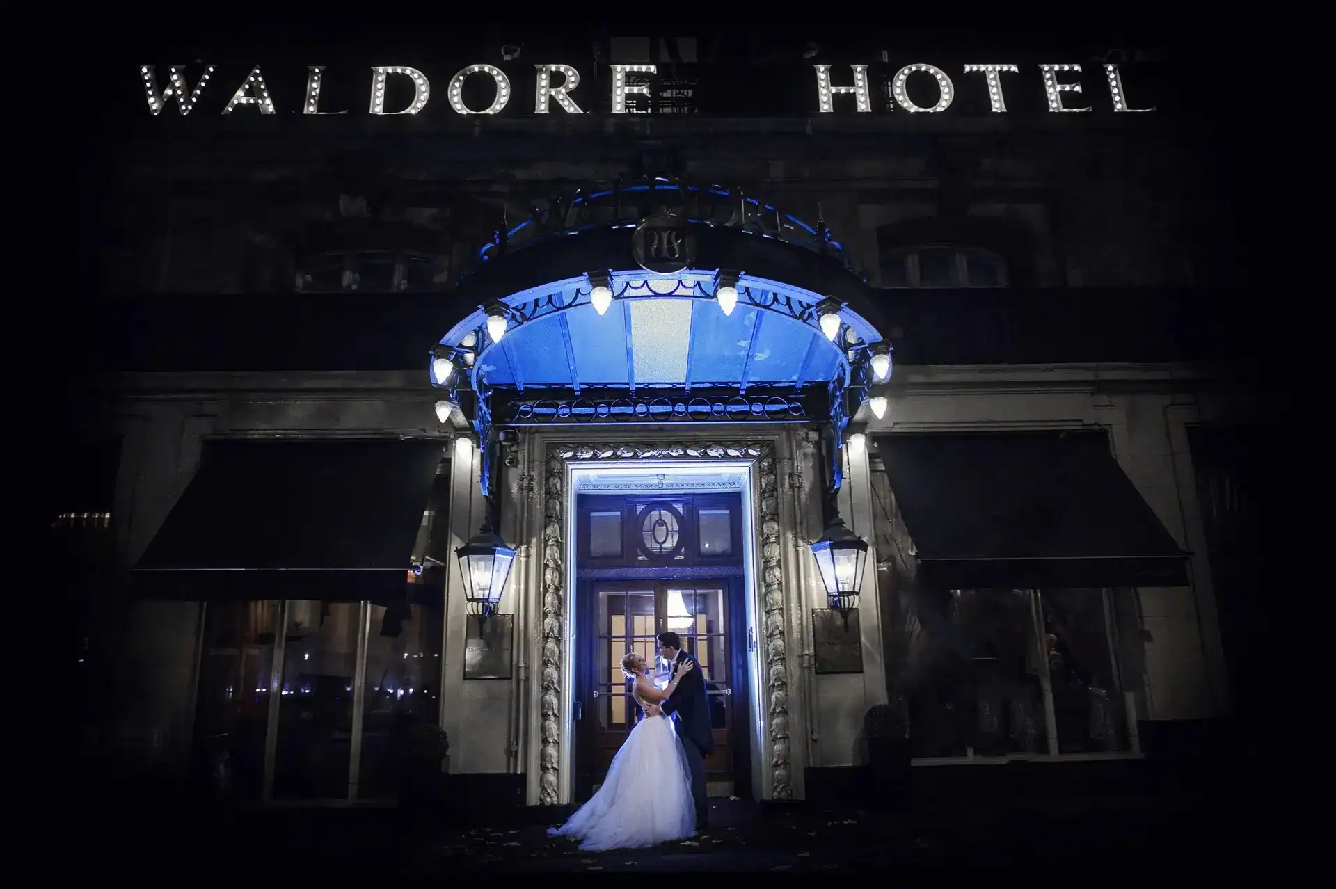 Happy couple gaze into each others eyes outside Waldorf Hotel London - Scott Gilbert Wedding Photography
