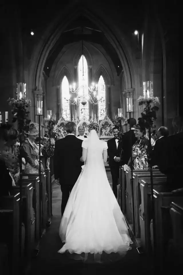 Bride and groom walking down the aisle in church - Scott Gilbert Wedding Photography