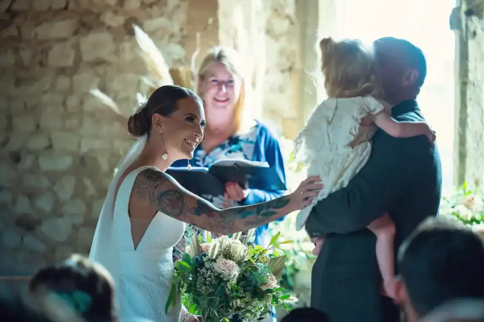 Bride greets flower girl at ceremony - Scott Gilbert Wedding Photography