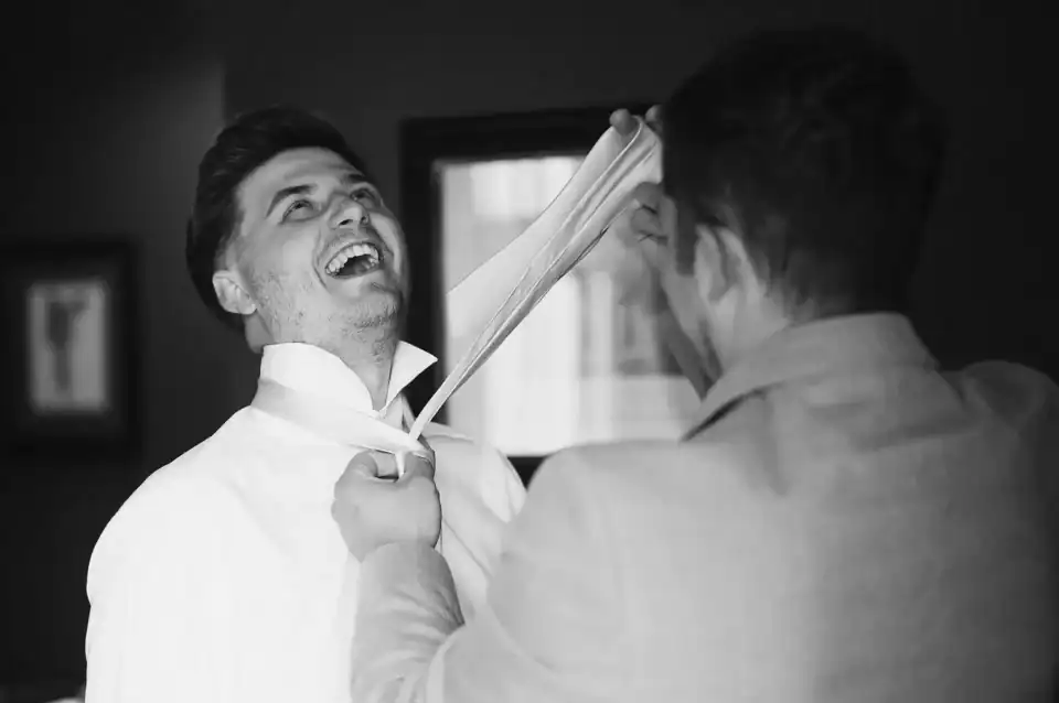 Groom gets helped doing up his tie - Scott Gilbert Wedding Photography