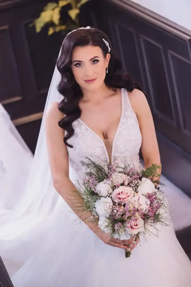 Bride holding her bouquet before ceremony at Swinford Manor - Scott Gilbert Wedding Photography