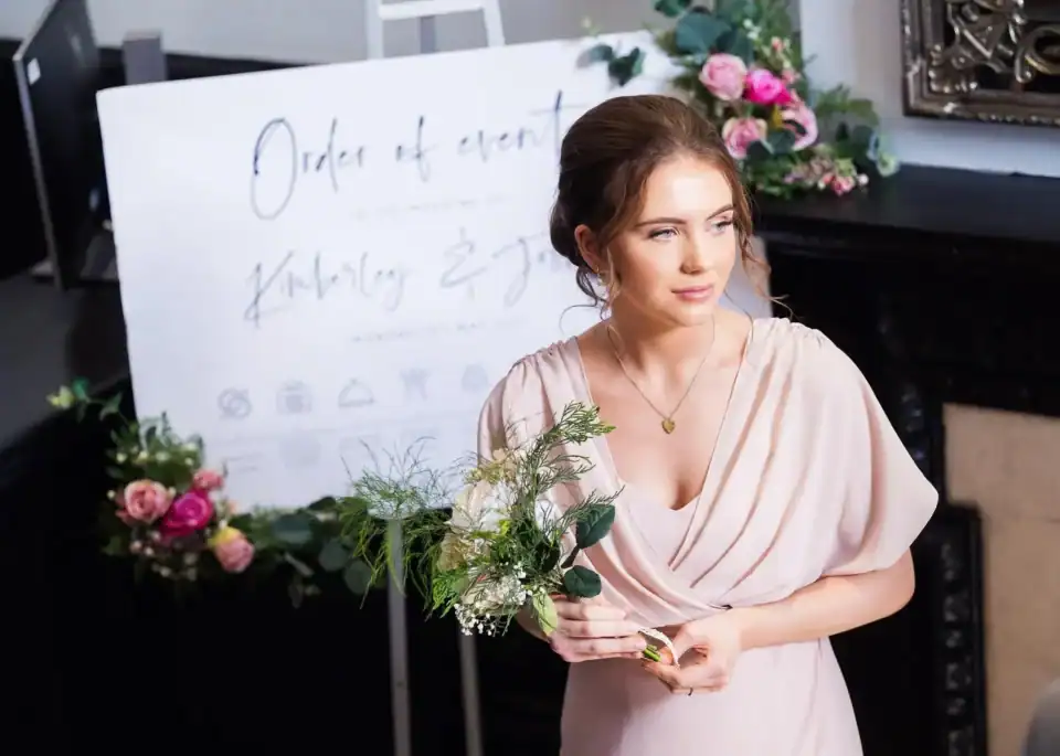 Bridesmaid awaits her moment in light pink dress - Scott Gilbert Wedding Photography