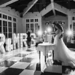 Bride and groom cut their cake at Swynford Manor wedding venue - Scott Gilbert Wedding Photography