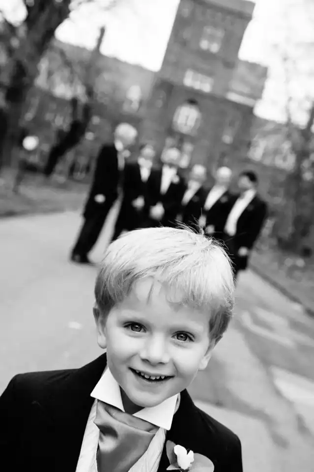 Page boy looking daper as the groomsmen watch - Scott Gilbert Wedding Photography