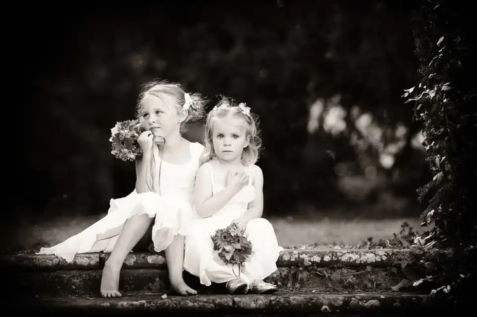 Flower girls sit on steps starring - Scott Gilbert Wedding Photography
