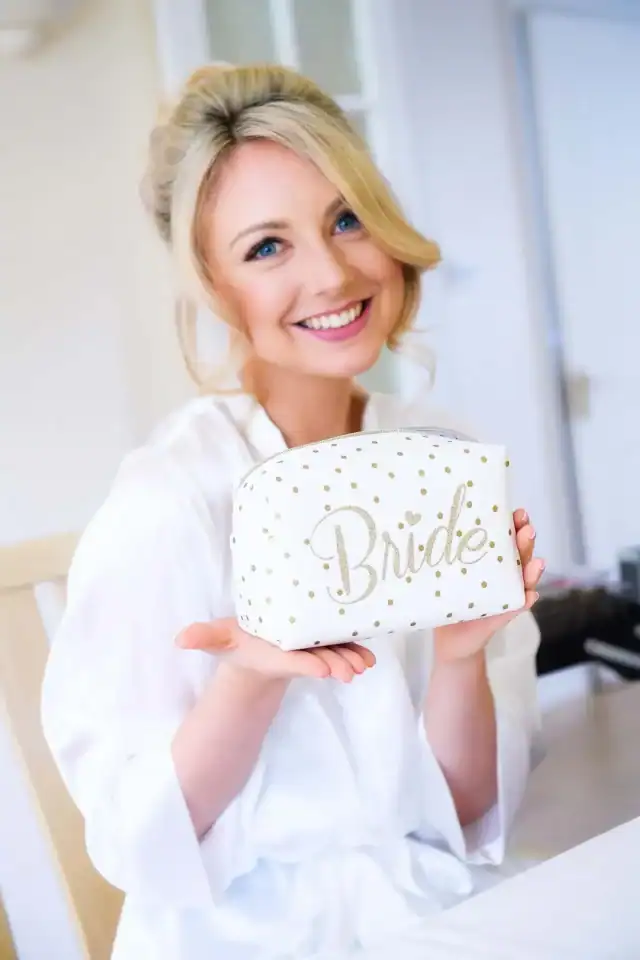 Bride getting ready before her wedding having her makeup done - Scott Gilbert Wedding Photography