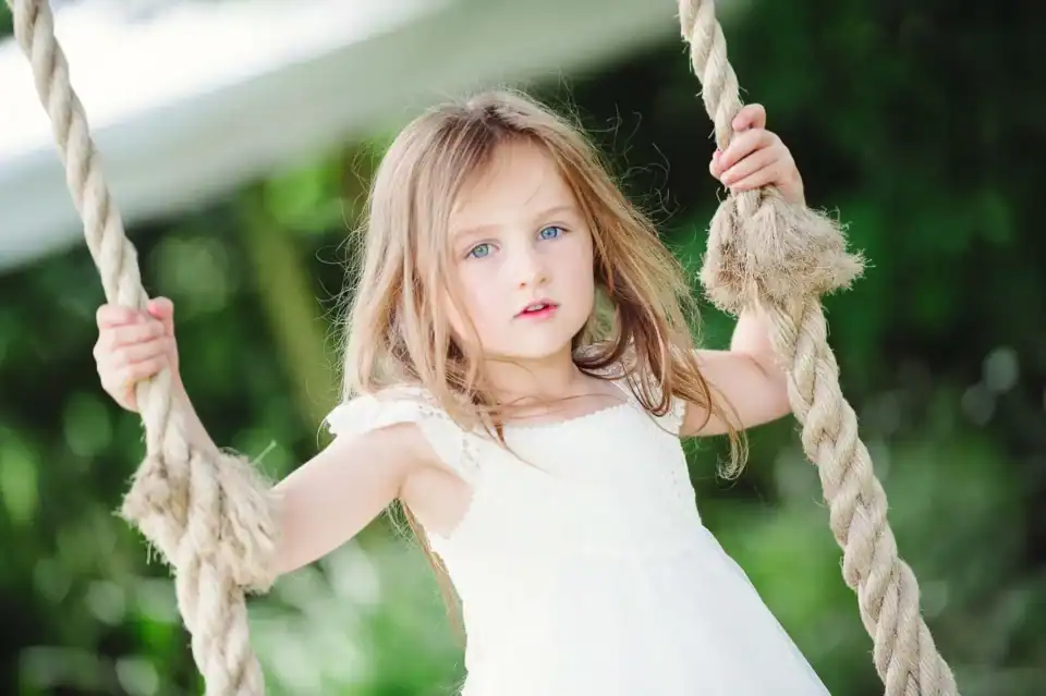Young bridesmaid on a rope swing - Scott Gilbert Wedding Photography
